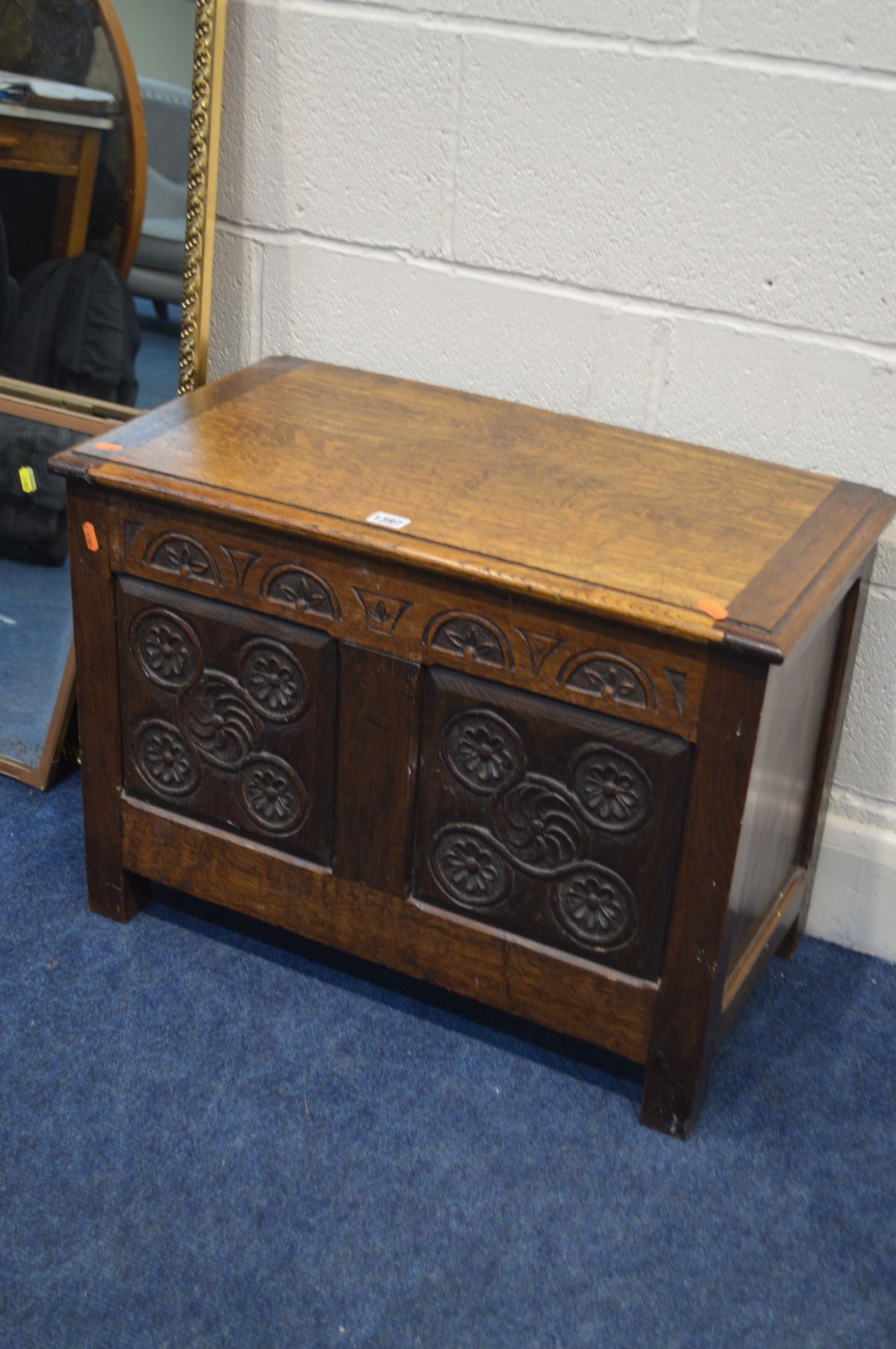 AN EARLY TO MID 20TH CENTURY OAK BLANKET CHEST, with lunette frieze above triple panel with - Image 2 of 2
