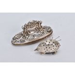 A SILVER PIN CUSHION AND NAIL BUFFER, the pin cushion on the form of a hedgehog, hallmarked