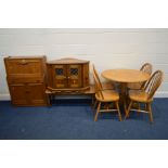 A MODERN BEECH CIRCULAR KITCHEN TABLE and four hoop back chairs, together with a 1980's teak bureau,