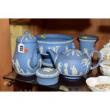 FIVE PIECES OF WEDGWOOD PALE BLUE JASPERWARE, comprising a pear shaped coffee pot, a circular