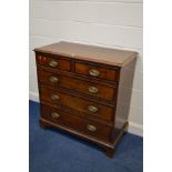 A GEORGIAN OAK CHEST OF TWO SHORT OVER THREE LONG, with crossbanding to each drawer front, brass