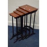 A REPRODUCTION MAHOGANY TOPPED QUARTETTO NEST OF FOUR TABLES, in an Edwardian style, on an