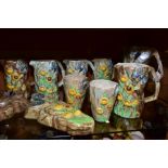 FOURTEEN PIECES OF RADFORD POTTERY BUTTERFLY WARE, comprising eight jugs, tallest height 22cm, two