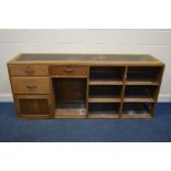 AN EARLY 20TH CENTURY GOLDEN OAK SHOP COUNTER, with three drawers, one drawer with a fitted cash