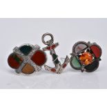 THREE SCOTTISH HARDSTONE BROOCHES, the first designed with a central circular cut orange stone