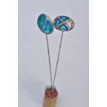 TWO SILVER ARTS AND CRAFTS ENAMEL HAT PINS, the first of circular form, with blue and green enamel