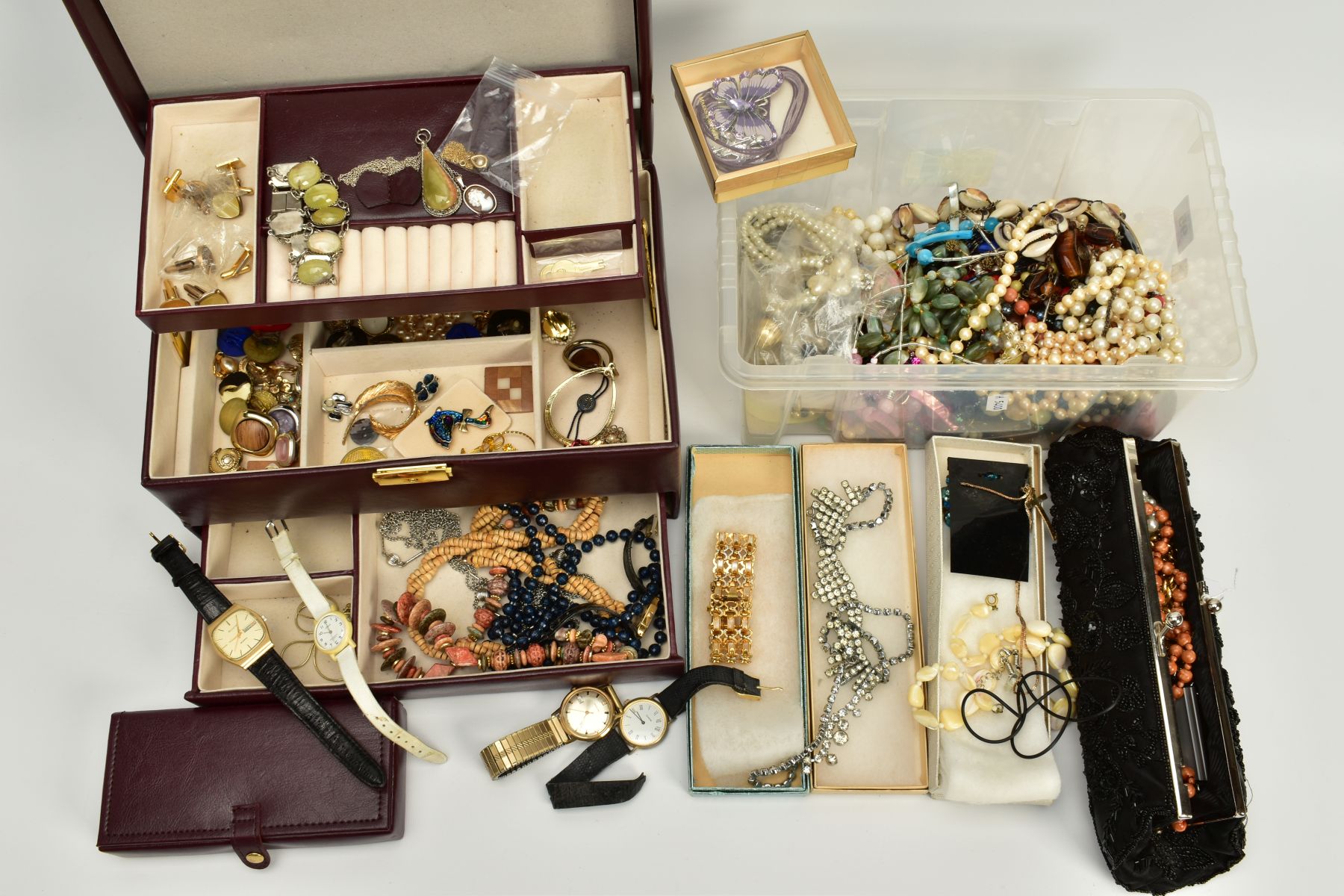 A BOX OF COSTUME JEWELLERY AND A BURGUNDY JEWELLERY BOX WITH CONTENTS, to include a yellow metal