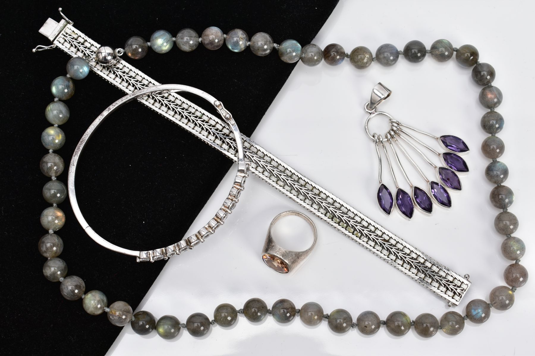 A SELECTION OF JEWELLERY, to include a white metal multi drop pendant, set with seven marquise cut