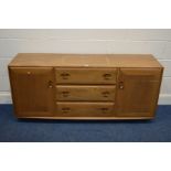 AN ERCOL WINDSOR MODEL 455 BLONDE ELM SIDEBOARD, three central drawers, the top drawer with a