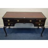 AN EDWARDIAN MAHOGANY LADIES DESK, with red and gilt tooled leather inlay top, five drawers, on