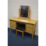 A WILLIS AND GAMBIER LIGHT SOLID OAK DRESSING TABLE, with four drawers, width 126cm x depth 48cm x