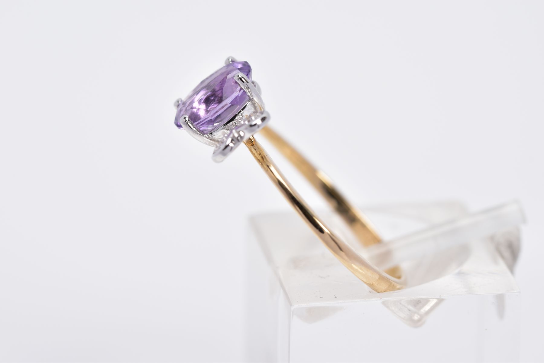 A 9CT GOLD AMETHYST AND DIAMOND RING, designed with a claw set, oval cut amethyst, with heart shaped - Image 2 of 3