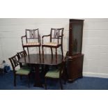 A MODERN MAHOGANY GATE LEG TABLE, six chairs including two carvers, together with a mahogany