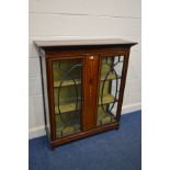 AN EDWARDIAN MAHOGANY, MARQUETRY INLAID AND STRUNG ASTRAGAL GLAZED DOUBLE DOOR BOOKCASE, width 111cm