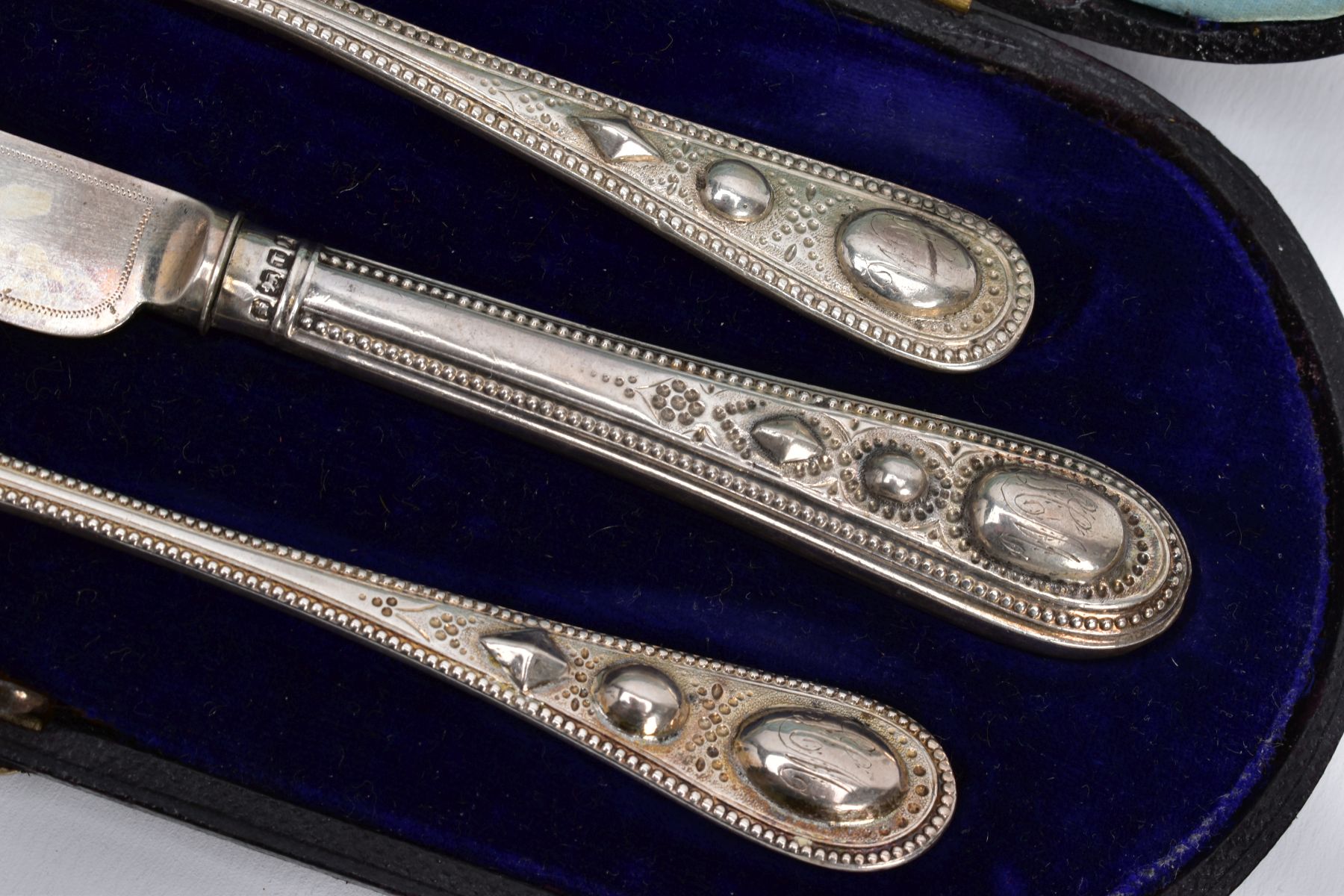 A CASED SET OF SILVER CUTLERY, to include a three-piece set of floral engraved beaded edge pattern - Image 2 of 3