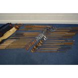 A LARGE COLLECTION OF VINTAGE HICKORY SHAFTED GOLF CLUBS, to include mainly irons, putters, woods,