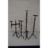 FOUR VARIOUS WROUGHT IRON CANDLE STANDS, and a small metal candle stand (5)