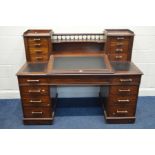 A VICTORIAN MAHOGANY DICKENS DESK, the top fitted with a hinged sloped black leather top, flanked by