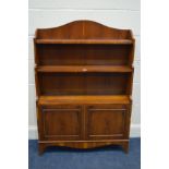 A YEW WOOD CASCADE BOOKCASE with double cupboard doors, width 84cm x depth 27cm x height 120cm