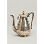 A VICTORIAN SILVER PLATED COFFEE POT, of baluster form, engraving to the belly, shell design to