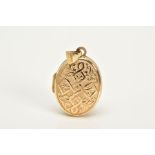 A 9CT GOLD LOCKET, of oval form, embossed Celtic cross and foliate design to the front, with a plain