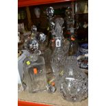 NINE GLASS DECANTERS AND A GLASS CLARET JUG WITH STOPPER, including a pair of George III style