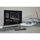 A CURRYS ESSENTIALS C15DIGB10 15'' LCD TV (with remote) together with a Shark steam mop, a bag of