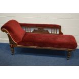 AN EDWARDIAN OAK SEVEN PIECE PARLOUR SUITE, comprising a chaise lounge on casters, length 180cm, a