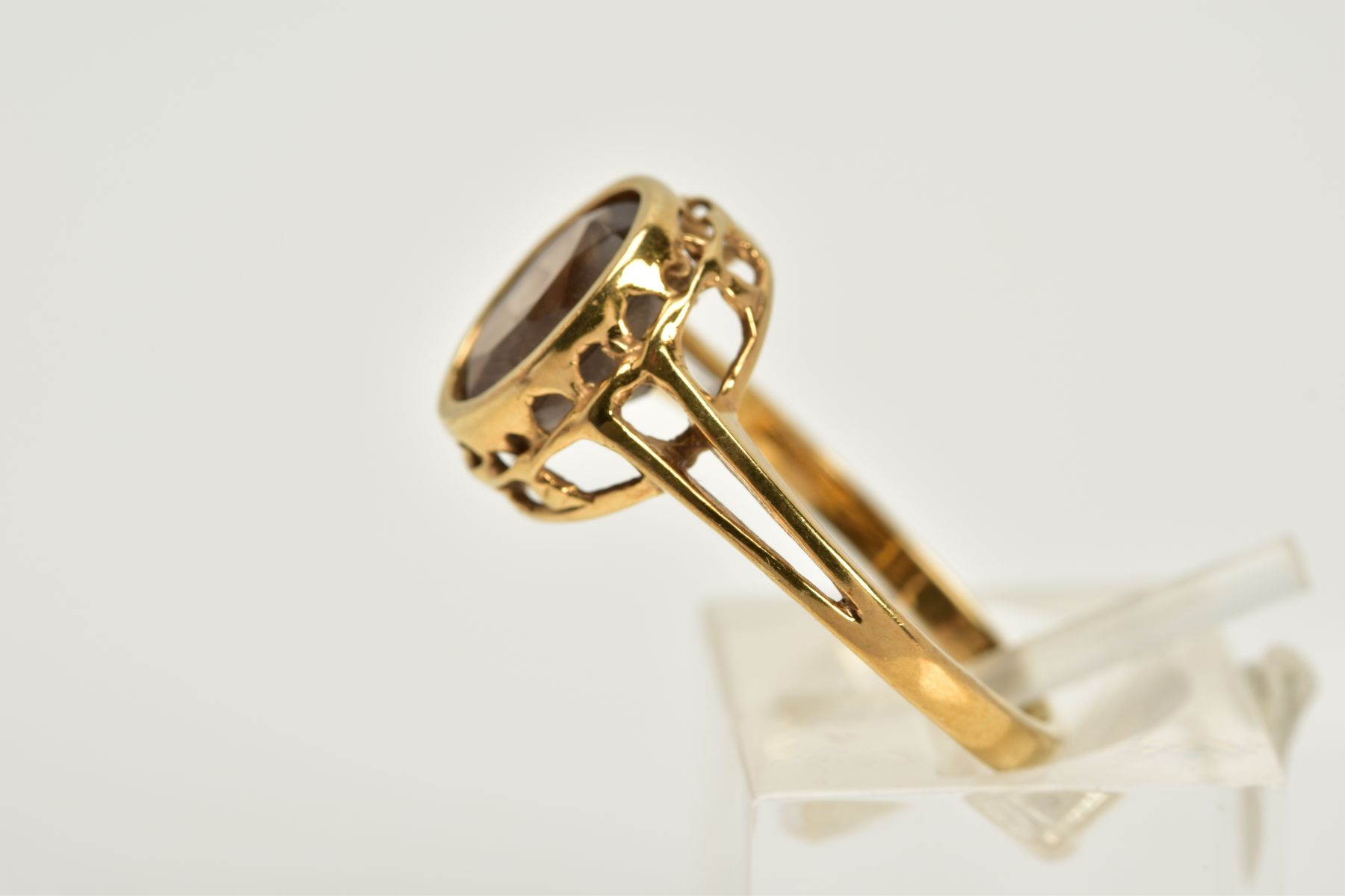 A 9CT GOLD SMOKEY QUARTZ RING, designed with an oval cut smokey quartz within a collet mount, - Image 2 of 3