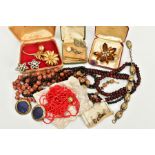 A BOX OF COSTUME JEWELLERY, to include items such as four carved wooden beaded necklaces, a multi