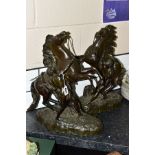 A PAIR OF FRENCH BRONZE MARLEY HORSE FIGURE GROUPS, after Coustou, depicting wild horses being