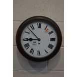 A MID 20TH CENTURY MAHOGANY CIRCULAR WALL CLOCK, single fusee movement, the bezel door enclosing a