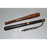 TWO WOODEN TRUNCHEONS, one stamped BPB146, length approximately 39cm, leather wrist strap to handle,