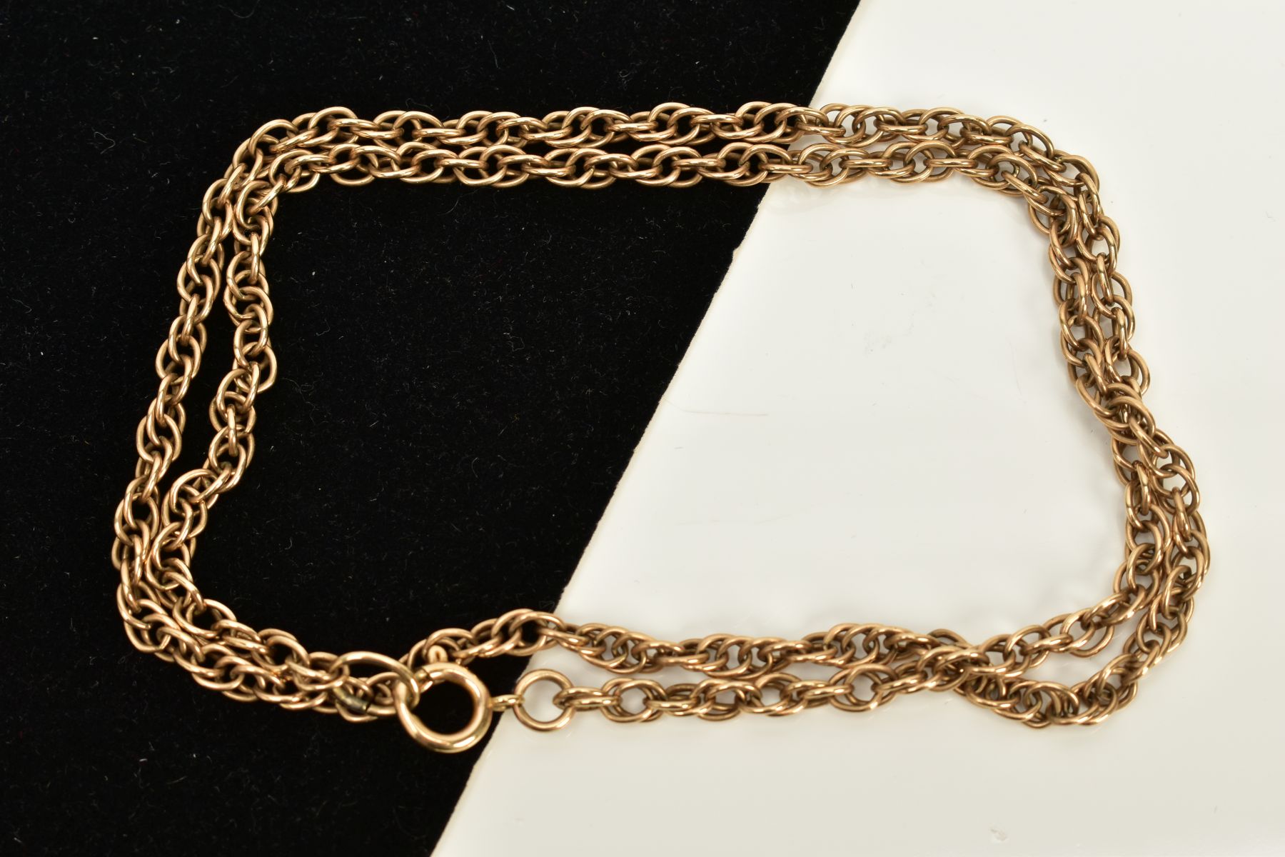 A YELLOW METAL CHAIN, Prince of Wales chain fitted with a spring clasp, length 520mm, approximate