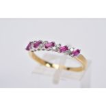 AN 18CT GOLD RUBY AND DIAMOND HALF HOOP RING, designed with a row of titled rectangular cut