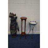 A CIRCULAR WROUGHT IRON PLANT STAND BASE, with a later ceramic wash basin, height 80cm together with