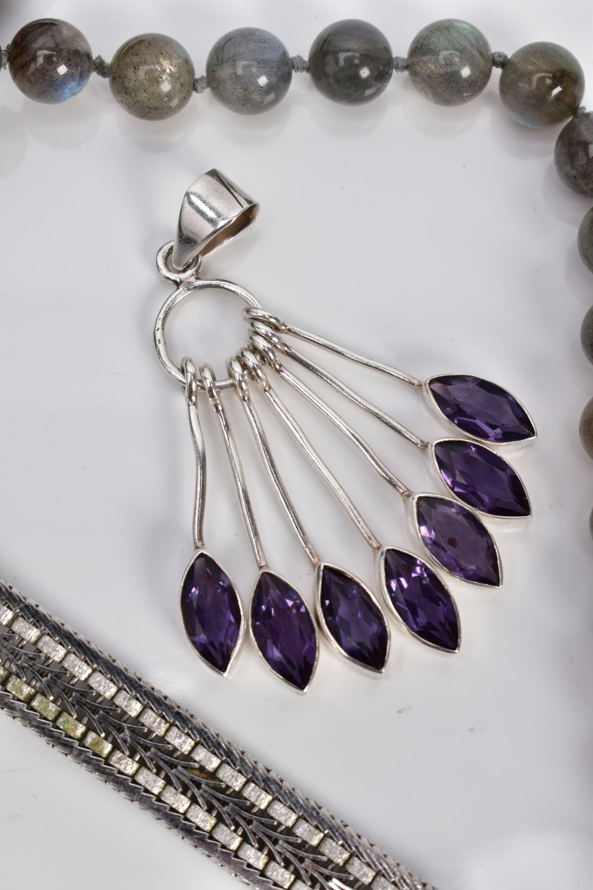 A SELECTION OF JEWELLERY, to include a white metal multi drop pendant, set with seven marquise cut - Image 3 of 4