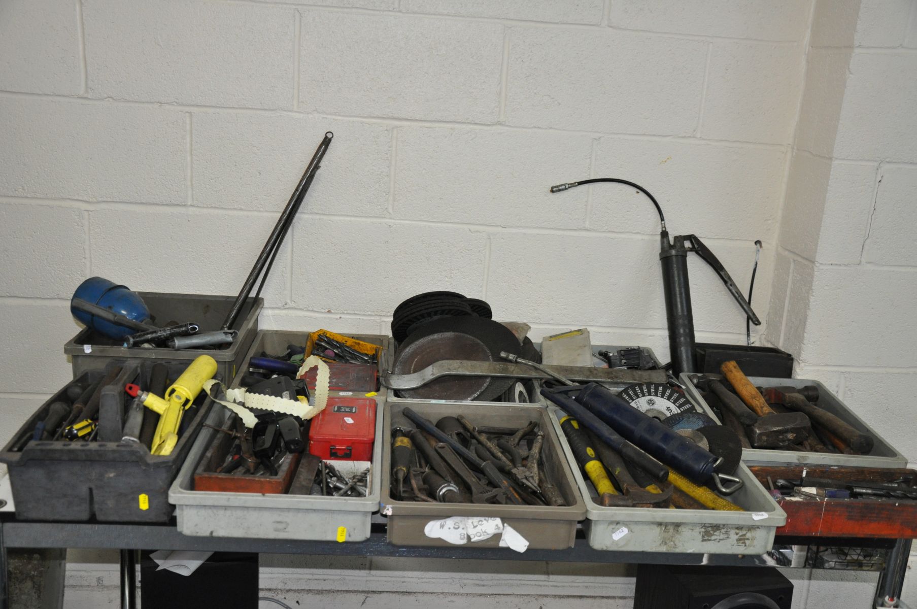 TEN TRAYS CONTAINING TOOLS incjuding drill bits, grease guns, hammers, grinding wheels, etc