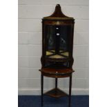 AN EDWARDIAN MAHOGANY, MARQUETRY INLAID AND STRUNG BOW FRONT CORNER CABINET, with a brass gallery,