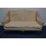 A VICTORIAN UPHOLSTERED WINGED TWO SEATER SETTEE, with flat outswept armrests, squab cushion and