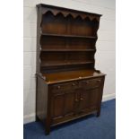 AN OAK DRESSER with two drawers, width 126cm x depth 50cm x height 201cm