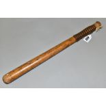 A LATE 19TH CENTURY WOODEN POLICE TRUNCHEON, painted with a crest and motto, impressed with CP