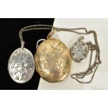 A LOCKET PENDANT NECKLACE AND TWO LOCKETS, the first a silver foliate engraved oval locket,