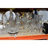 A COLLECTION OF GLASSWARE, including two carafes, four decanters with stoppers, a part suite of
