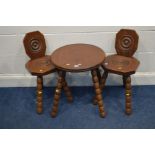 A PAIR OF MID TO LATE 20TH CENTURY MAHOGANY SPINNING CHAIRS together with a matching circular