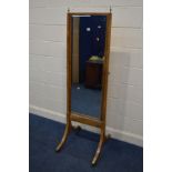 A LATE 19TH CENTURY WALNUT RECTANGULAR CHEVAL MIRROR, on twin swept legs with brass caps and