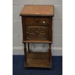 AN EARLY TO MID 20TH CENTURY OAK POT CUPBOARD with an orange marble style finish top, single