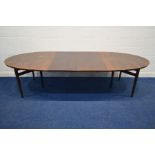 ARNE VODDER FOR SIBAST MOBLER, a 1970's rosewood extending dining table, rounded ends, each end on