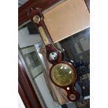 AN EARLY 19TH CENTURY MAHOGANY AND SATINWOOD STRUNG WHEEL BAROMETER, broken swan neck pediment, with
