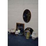 AN OAK OVAL WALL MIRROR, a golden oak framed wall mirror, three various other circular wall mirrors,